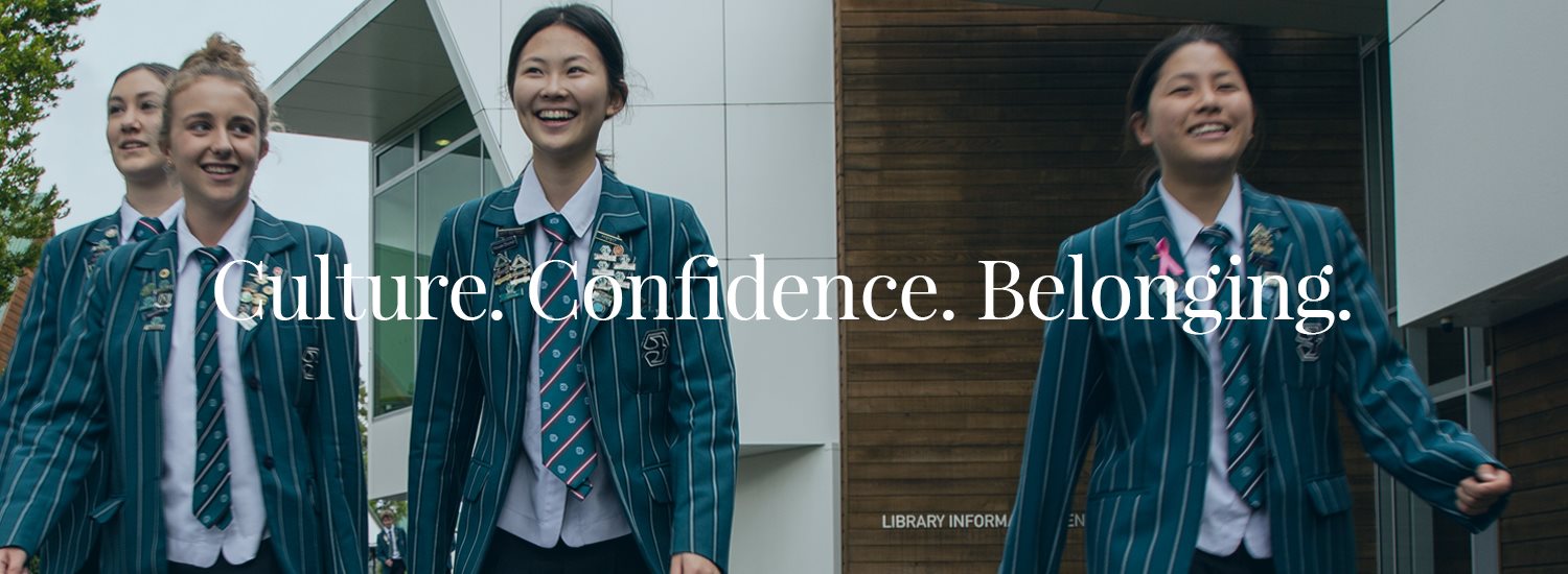 Group of smiling students in school uniforms